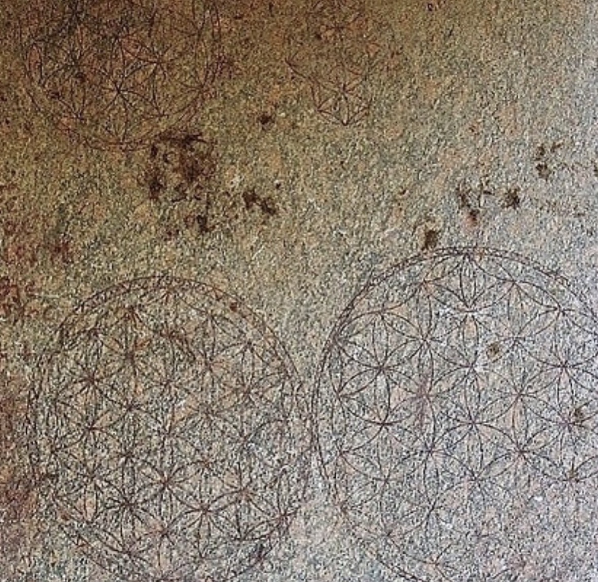 Flower of Life markings on stone
